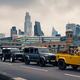 Six Land Rover Defenders line up on Southwark Bridge in London